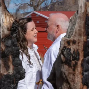 A couple takes their vows with wedding officiant Dan Jones