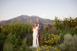 Wedding portrait of a happy couple at SpiriTaos Gardens in Taos