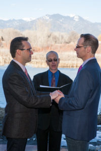 An intimate same sex marriage in late winter. Taos Mountain in the background.