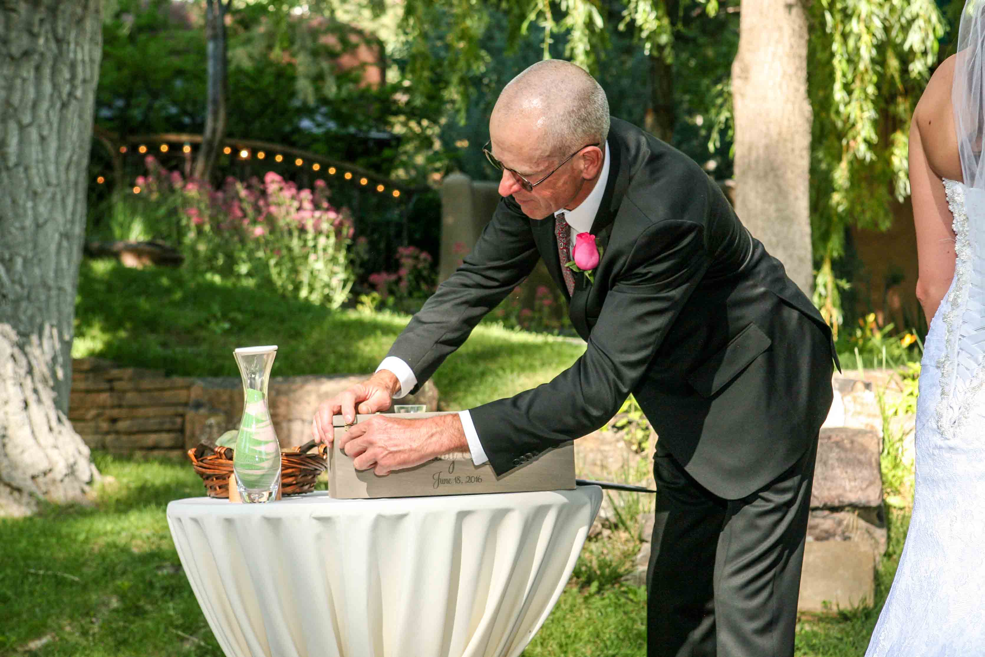 Taos wedding minister sealing the Wine Box at the ceremony conclusion.