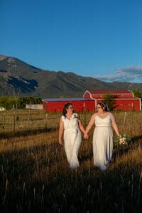 Dramatic sunset photo of brides in the SpiriTaos meadow in New Mexico