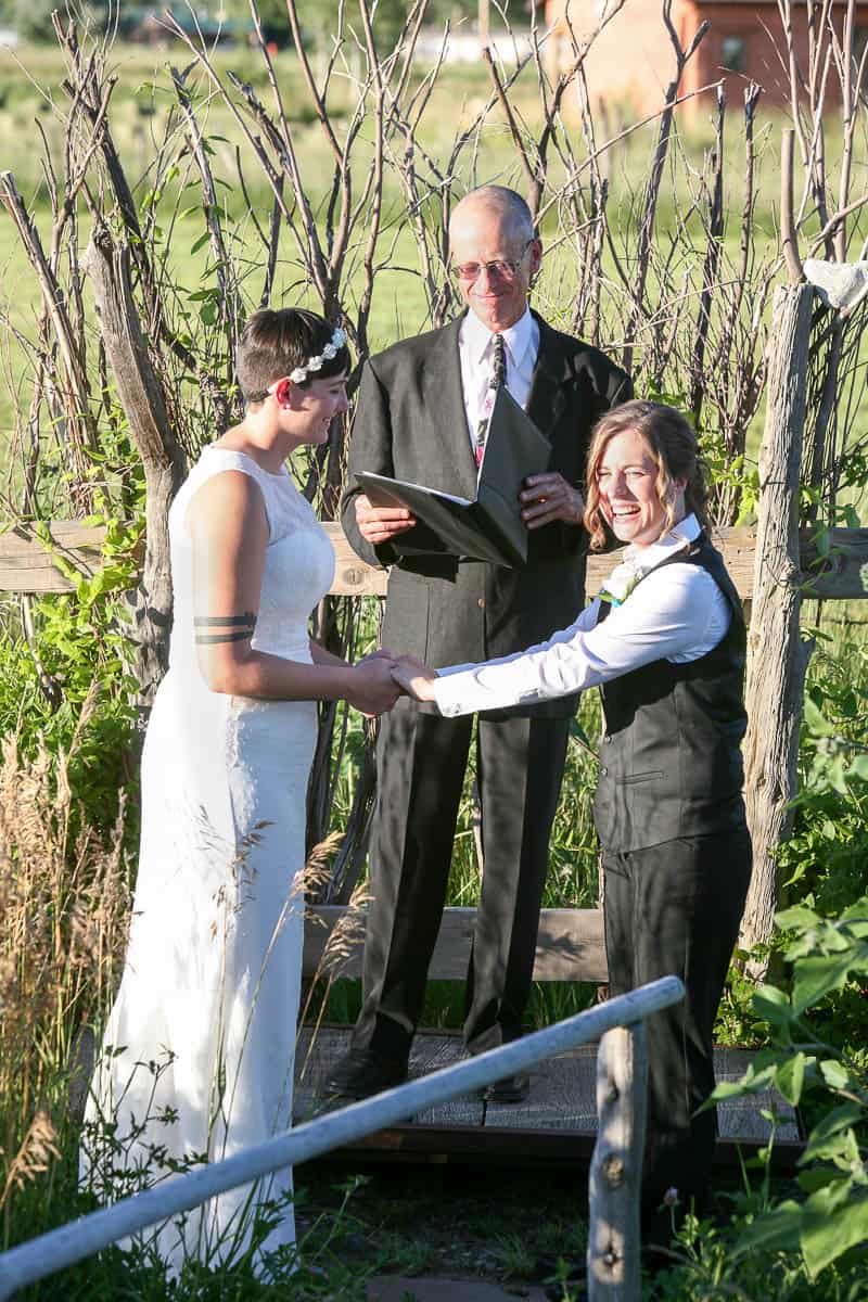 A couple laughs at the beginning of their wedding ceremony