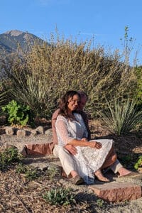 Bride and groom posing for a photo at SpiriTaos Gardens