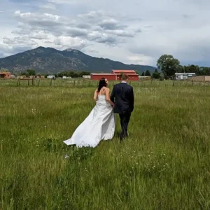 A spacious wedding portrait of the big sky in New Mexico after this couple's wedding at SpiriTaos