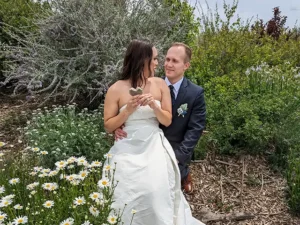 A couple poses for portraits in the SpiriTaos gardens