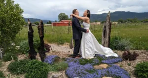 A wedding portrait of a couple in SpiriTaos Gardens, an intimate wedding venue in Taos NM