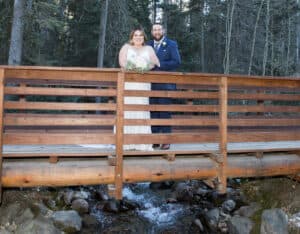 Wedding photo at the Midway Bridge at Taos Ski Valley