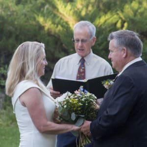 Wedding celebrant Dan Jones busy marrying this couple