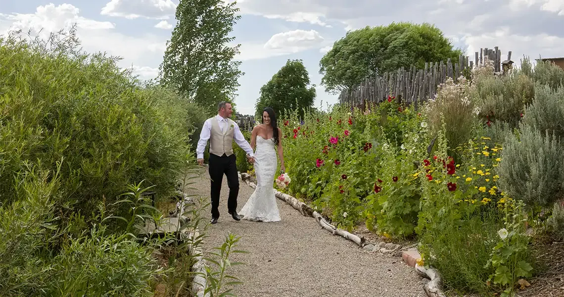 Before their wedding, a couple strolls the paths at SpiriTaos