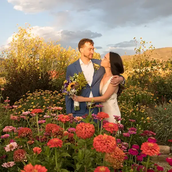 SpiriTaos Gardens surrounds this happy married couple with fragrance and color