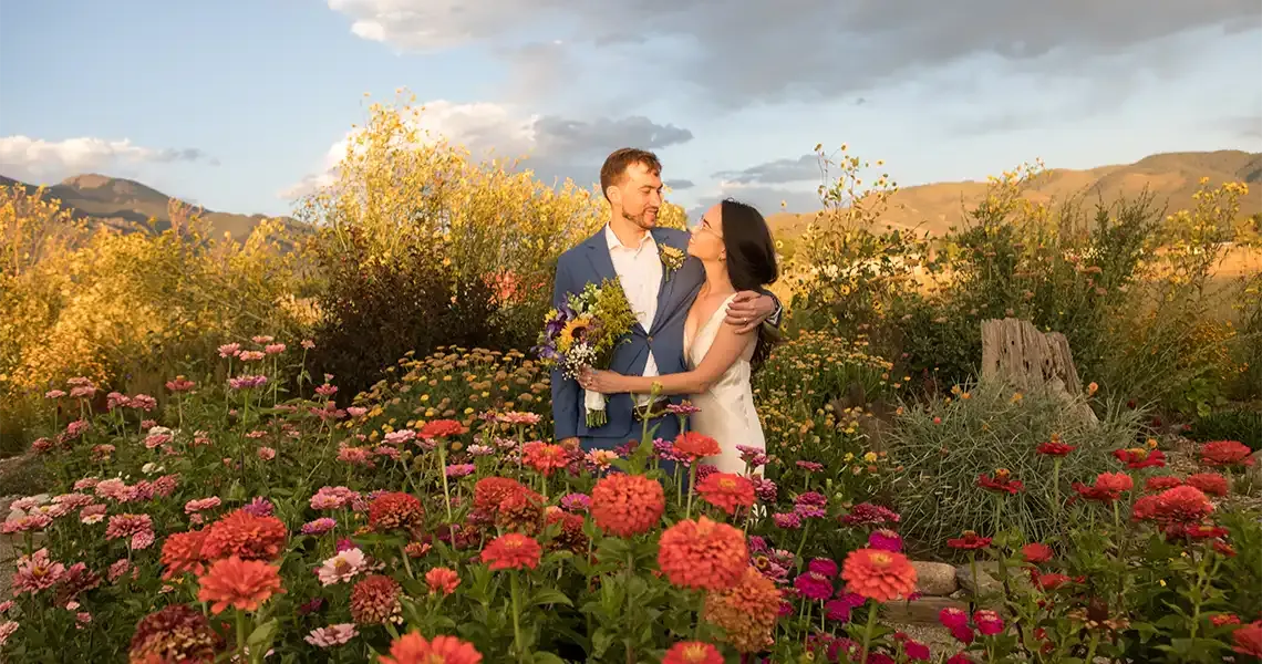 SpiriTaos Gardens surrounds this happy married couple with fragrance and color