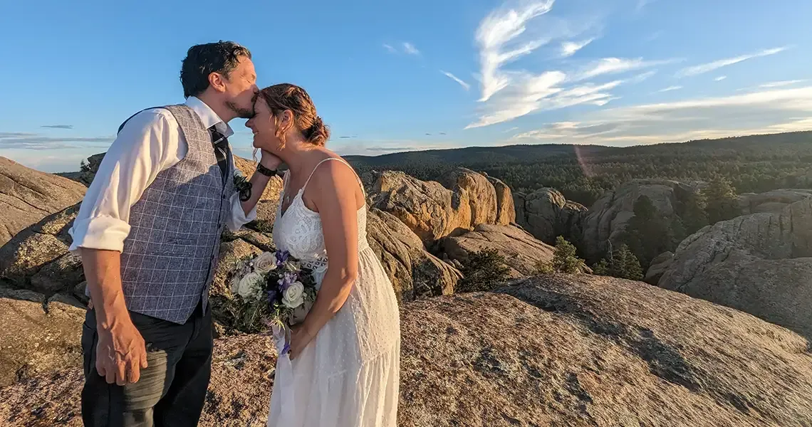 A couple kisses after their wedding