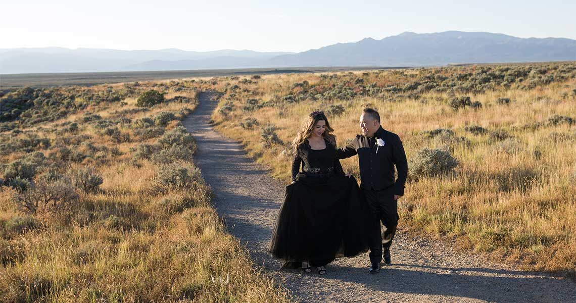 Gorgeous autumn colors surround this happy couple after their wedding
