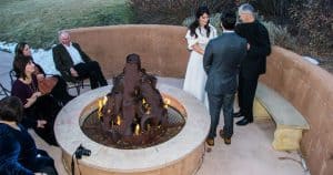 An intimate wedding around the fire pit at El Monte Sagrado in Taos