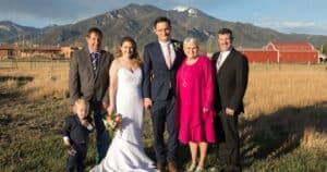 family pose for a professional portrait at a micro wedding in Taos