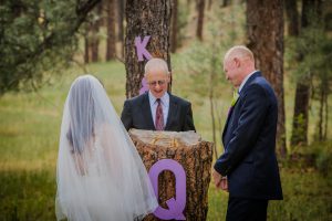 Dan Jones officiating a wedding while keeping the bride and groom relaxed